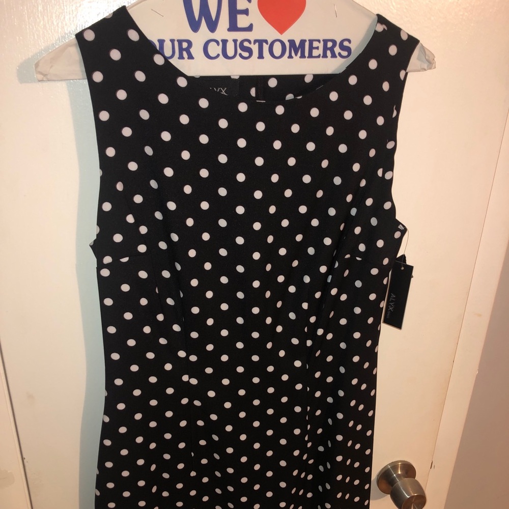 Black and white polka dot sleeveless dress. Size 6. Never worn. Tags on.